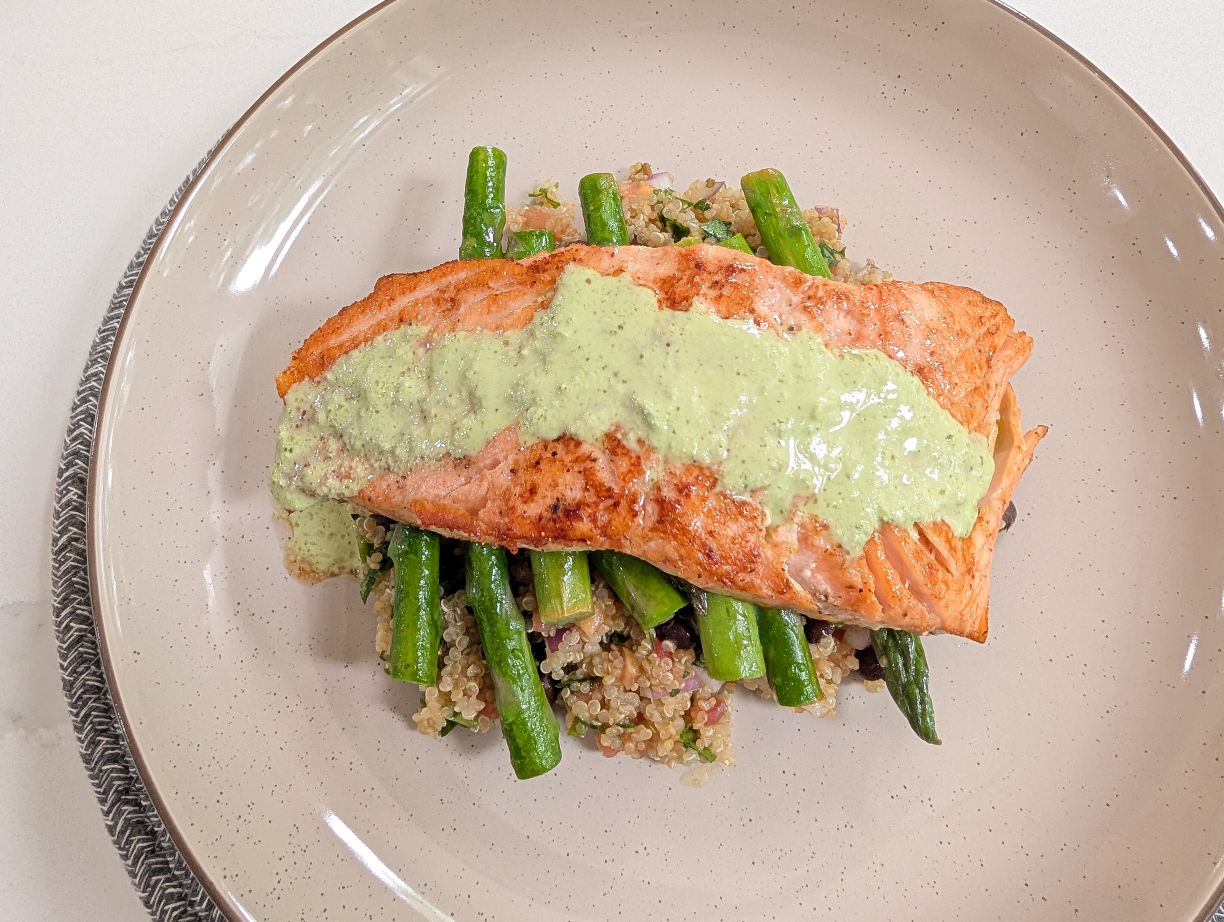 Seared salmon over quinoa salad